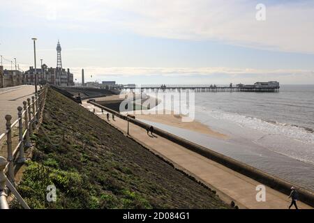 Promenade on the seafront with the Tower and North Pier in the background at Blackpool, Lancashire, England, UK Stock Photo