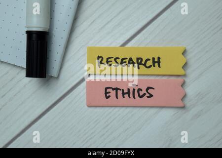 Research Ethics text on sticky notes isolated on office desk Stock Photo