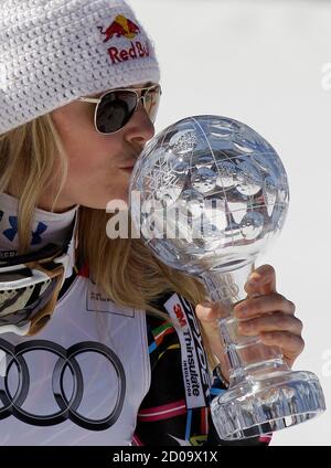 Lindsey Vonn of the U.S. kisses a trophy of the women's Super G discipline at the alpine ski World Cup finals in Schladming March 15, 2012.       REUTERS/Leonhard Foeger (AUSTRIA  - Tags: SPORT SKIING)