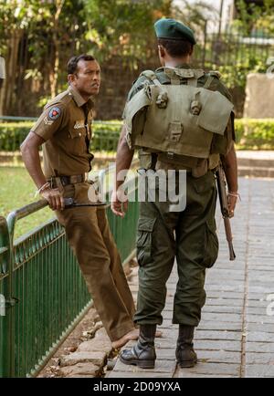 Kandy, Sri Lanka - 09-03-24 - Sri Lanka Military Stands Guard In Temple.