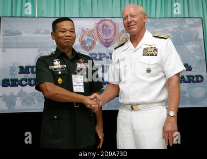 U.S. Navy Admiral Robert F. Willard (R), Commander of the U.S. Pacific Command, shakes hands with Armed Forces of the Philippines (AFP) Chief of Staff Lieutenant General Ricardo David after the Philippines-U.S. military annual bilateral security briefing at Camp Aguinaldo in Quezon City Metro Manila August 18, 2010. Philippines and the United States discussed mutual security concerns as well as non-traditional defense issues including regional security challenges, maritime security, combating terrorism, mutual defense, humanitarian assistance/disaster response, global peace operations initiati