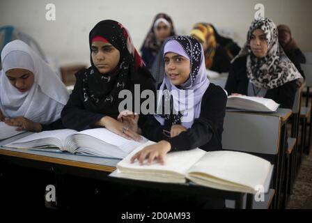 Blind students read the Koran in Braille during class at the 