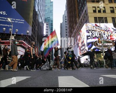 New York, United States. 02nd Oct, 2020. Protesters hold rainbow flags as they march on Seventh Avenue at The People's March for Roxanne Moore Protest in New York City on Friday, October 2, 2020. Roxanne Moore a 29-year-old Black transgender woman from Reading, Pennsylvania was shot 16 times by police officers. Photo by John Angelillo/UPI Credit: UPI/Alamy Live News Stock Photo