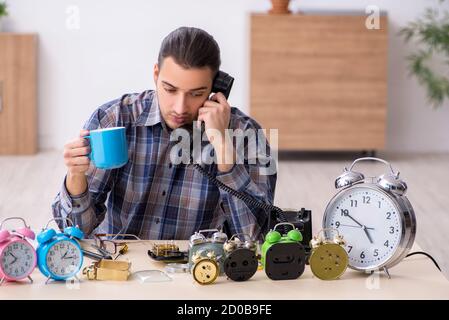 Young watchmaker working in the workshop Stock Photo