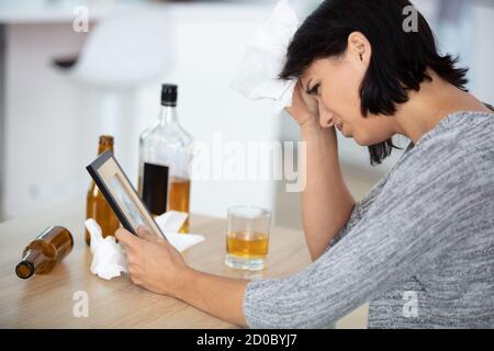 depressed woman having problems with alcohol Stock Photo