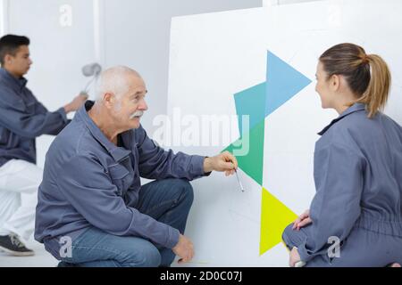 craftsman and female apprentice Stock Photo