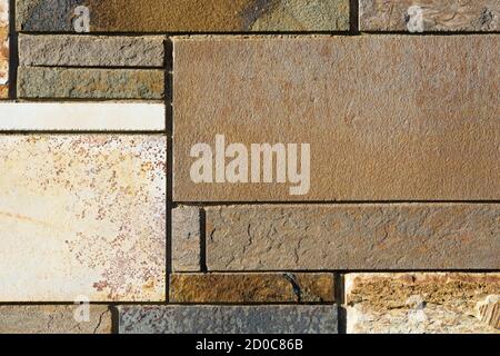 Slate background texture and tile pattern on an external building wall. Stock Photo