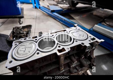 New pistons and cylinder head of engine block vehicle. Motor capital repair. Sixteen valve and four cylinder. Car service concept. The job of a Stock Photo