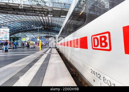 Berlin, Germany - August 20, 2020: DB logo Deutsche Bahn German railways ICE 4 high-speed train at Berlin main railway station Hauptbahnhof Hbf in Ger