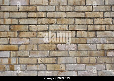 Cream and white brick wall background in abstract patterns with close up view. Stock Photo