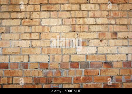 Brick wall texture with cream coloured bricks in line patterns. Stock Photo