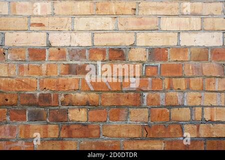 Brick wall background with cream bricks and textured patterns. Stock Photo