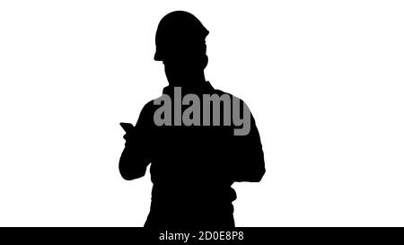 Engineer walking and using smartphone, Alpha Channel Stock Photo