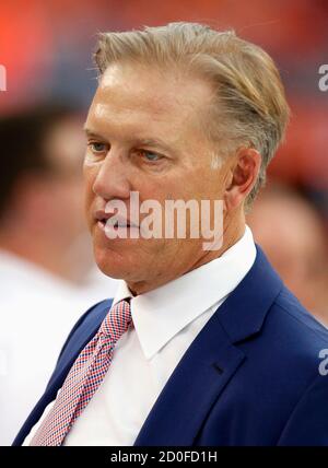 Denver Broncos Executive Vice President of Football Operations John Elway  walks on the field before their NFL football game against the Baltimore  Ravens in Denver September 5, 2013. REUTERS/Rick Wilking (UNITED STATES -