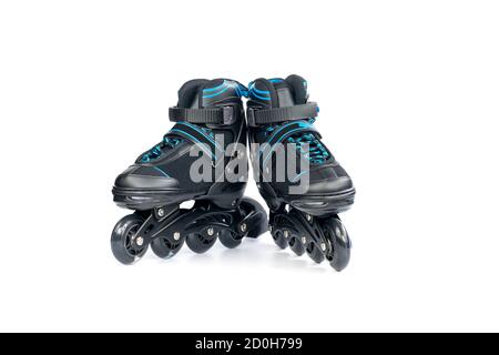 Pair of children's new inline skates isolated on white background. Stock Photo