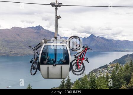 Queenstown, New Zealand: Bike Transport with the Skyline Gondola. In the background the scenic view of Lake Wakatipu.