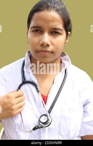 Female doctor with stethoscope and serious look portrait. Stock Photo