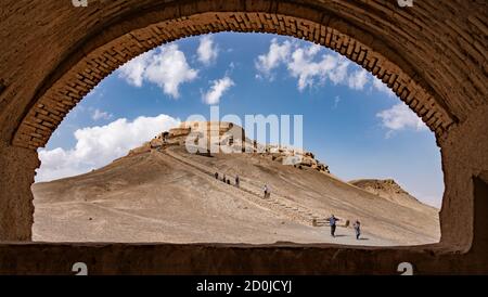 Yazd, Iran - 2019-04-11 - Stairs lead up to top of Tower of Silence where human sacrafice was once practiced as seen through arch. Stock Photo