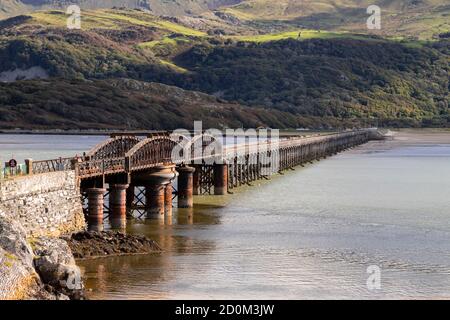 Barmouth railway bridge over the Mawddach estuary on the Wales coast Stock Photo