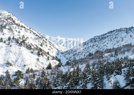 Beautiful winter landscape of the Tien Shan mountains in Uzbekistan on a Sunny clear day Stock Photo
