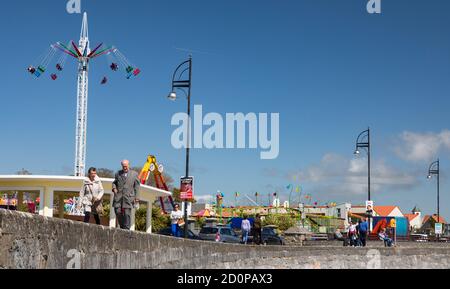 GALWAY CITY, IRELAND - 5th May, 2018: People walking on Salthill promenade on  the beach in Galway city on a sunny spring afternoon Stock Photo