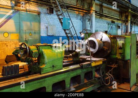 Working green lathe in the metalworking workshop Stock Photo