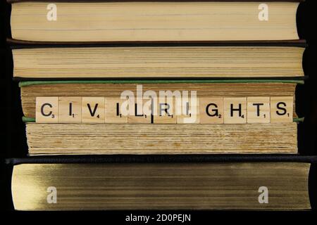 View on stacked old books with word civil rights (focus on center) Stock Photo