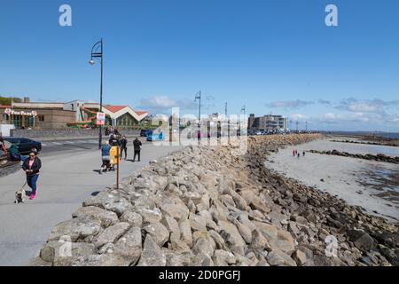 GALWAY CITY, IRELAND - 5th May, 2018: Salthill promenade on the beach in Galway city on a sunny spring afternoon Stock Photo