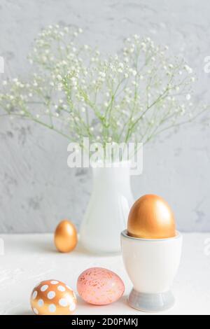 Composition with beautiful Easter eggs, Gypsophila flowers and ...