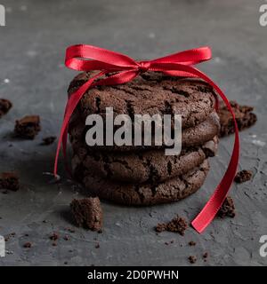 Tall stack of soft homemade chocolate chip cookies with a bite mark Stock Photo