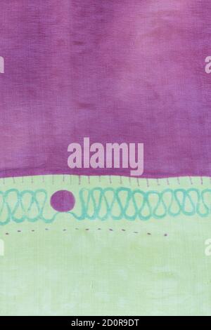 detail of handpainted silk scarf - abstract purple and green texture background Stock Photo