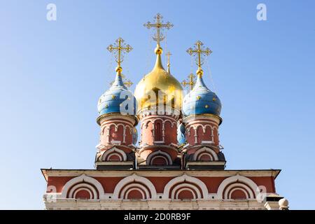 Dome of Church of St George the Victorious (Church of the Holy Great Martyr George) on Pskov Mount on Varvarka street and blue sky on background Stock Photo