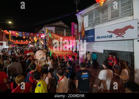 Georgetown, Penang/Malaysia - Feb 02 2020: People take photo with mascot during chinese new year. Stock Photo