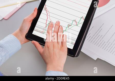 Hands holding tablet with digital marketing. Stock Photo