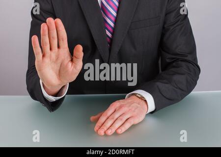 Close up businessman showing stop gesture with hand. Stock Photo