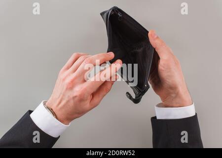 Mans hands open an empty wallet. Stock Photo