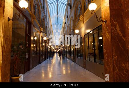 Interior of Passage Choiseul ,designed by Francois Mazois, 1827 - shopping area with clothing stores, book stores, jewelers shops and art galleries. Stock Photo