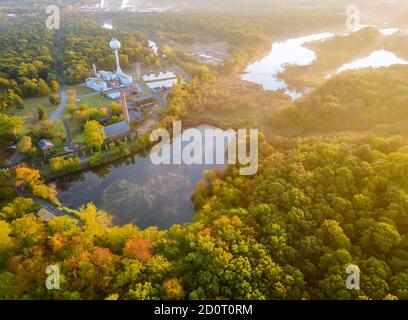 Forest in the autumn from a height a beautiful panorama of beautiful calm lake at sunrise, morning landscape
