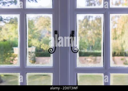 Condensation on double glazed wooden windows due to cold bridging, UK Stock Photo