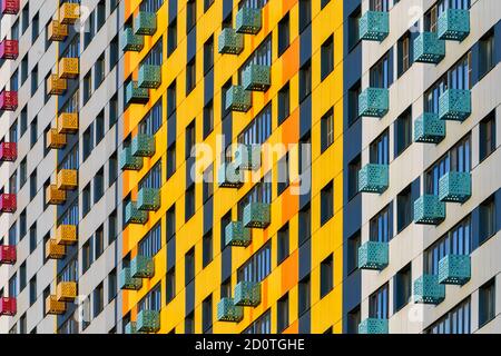 Colorful pattern from windows and balconies in modern residential building Stock Photo