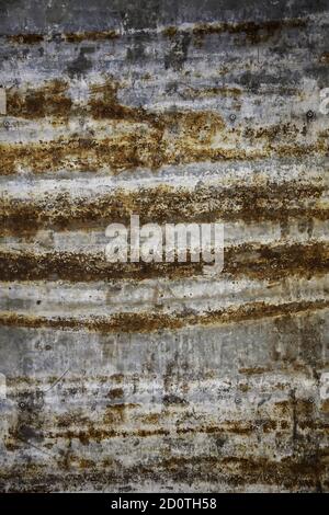 Spoiled and rusty metal wall, neglect and ruin in the city Stock Photo