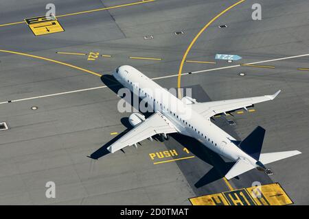 Aerial view of airport. Airplane taxiing to runway before take off. Stock Photo