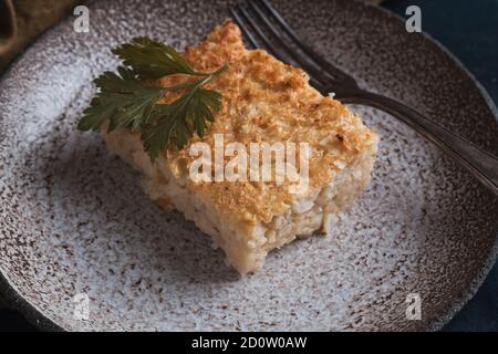 cauliflower casserole on a plate and dark background Stock Photo