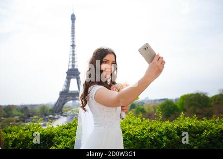 young woman walks in white lace dress, high-heeled shoes, Paris, Stock Photo