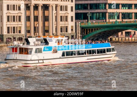 Tourists aboard the London Eye River Cruise boat Silver Bonito on the River Thames. Stock Photo