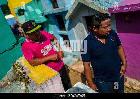 Mayan peasants participate in the bone cleansing ritual at the cemetery in Pomuch, Mexico. Stock Photo