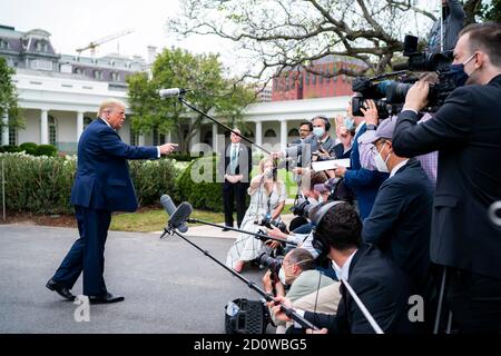 President Donald J. Trump talks to members of the press along the South Lawn driveway Thursday, September 24, 2020, prior to boarding Marine One en route to Joint Base Andrews, Maryland to begin his trip to North Carolina and Florida. (USA) Stock Photo