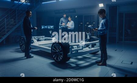 International Team of Automobile Design Engineers Discussing Design of ...