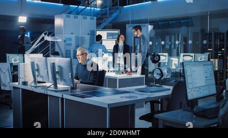 Diverse International Team of Industrial Engineers and Scientists Working in Research Laboratory and Development Center. People Working with 3D Stock Photo