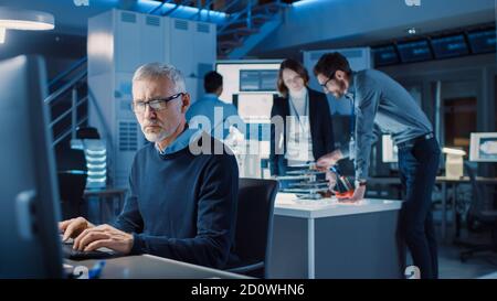Diverse International Team of Industrial Engineers and Scientists Working in Research Laboratory Development Center. People Working on Efficient Stock Photo